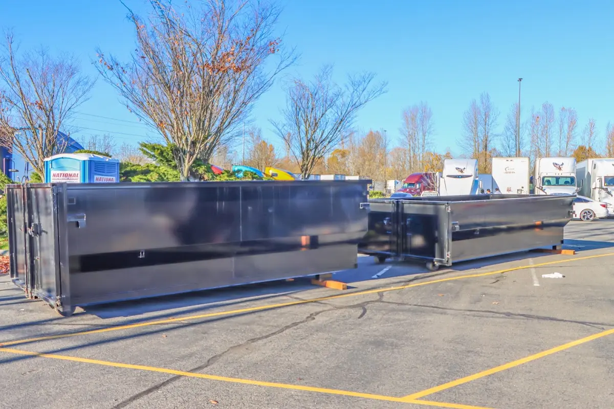 Professional dumpster rental service with roll-off container on residential driveway in Skokie